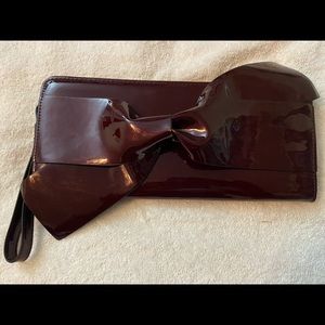 A new day, burgundy patent leather clutch